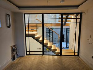 Centre spine staircase turning 90 degrees with corner landing